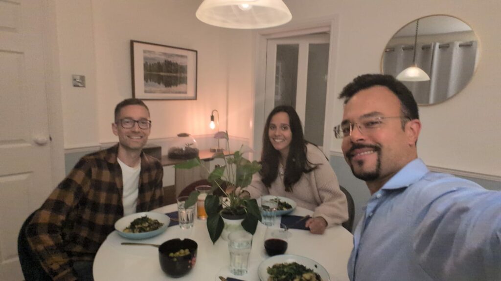 Rich, Amanda and James having dinner and chatting TripPA.